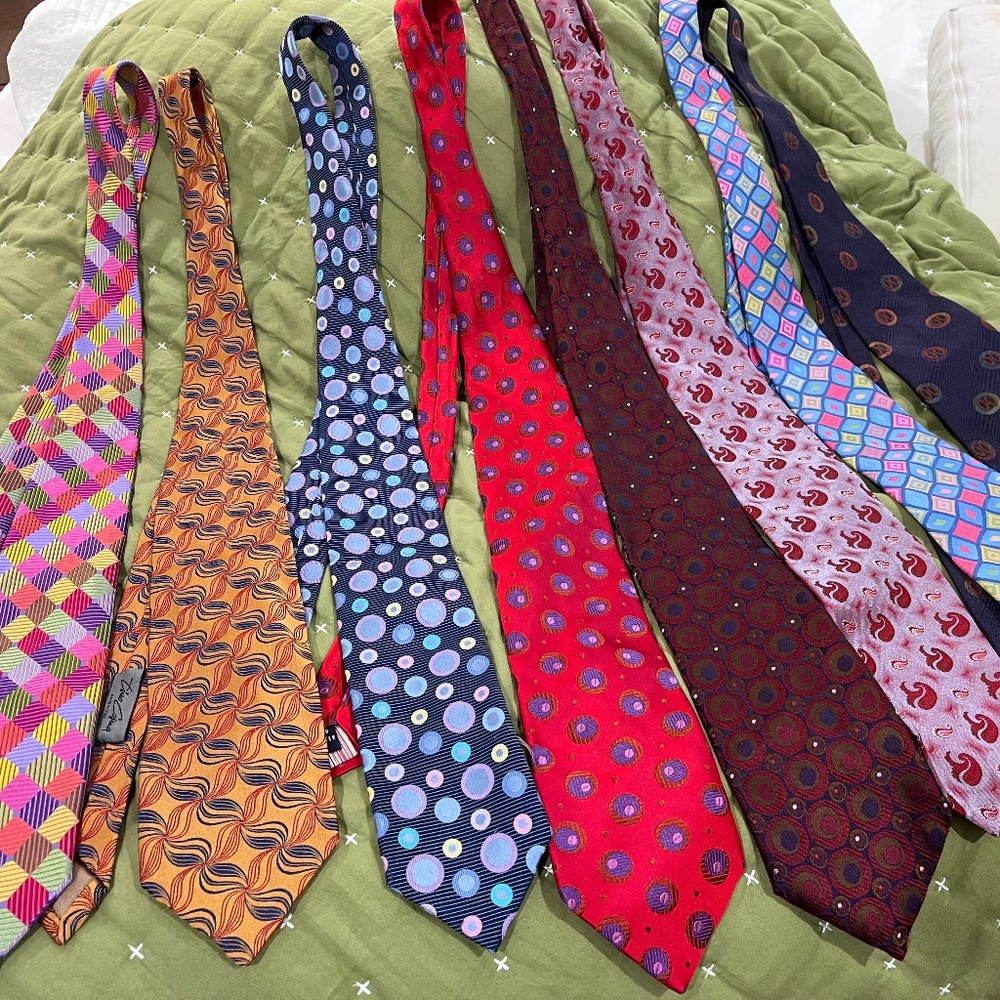 A collection of eight 100% silk mens neckties
